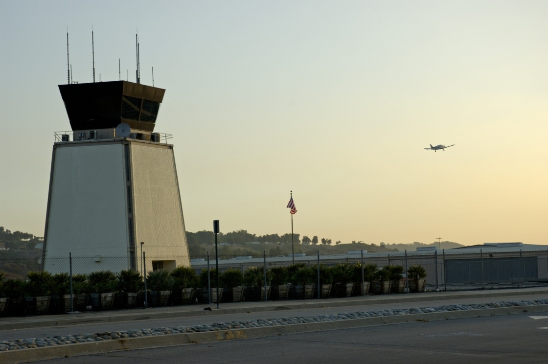 'Airport traffic control tower at sunset with small airplane taking off' - Gran Canaria